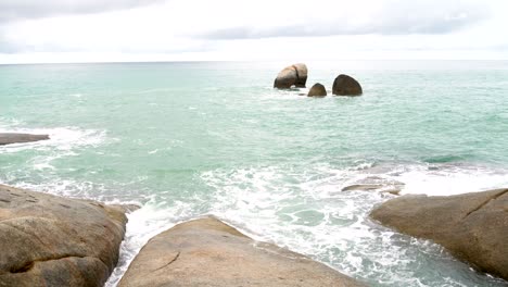 ocean waves wash stones