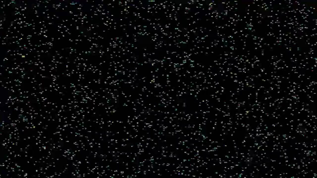 Small Bubbles Rising in Water Against Black Background