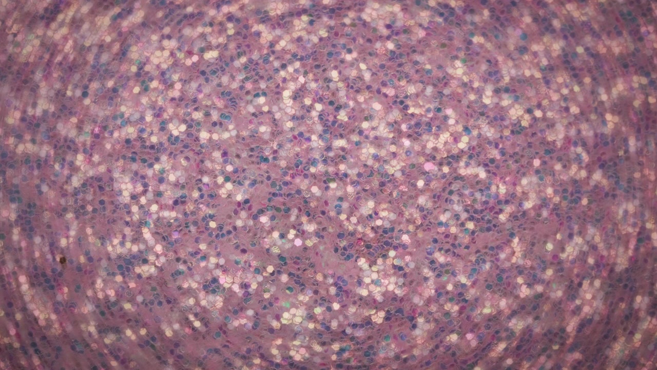 Abstract background of colorful glowing glitter