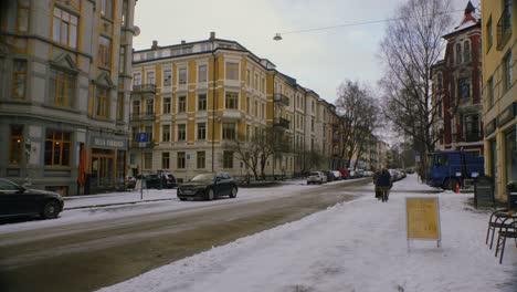 snowy city street in oslo, majorstuen neighborhood with cars, snow, winter-1