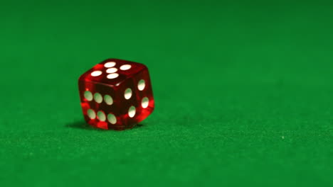 red dice spinning on casino table