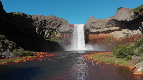 AERIAL---Rainbow-in-Salto-del-Agrio-waterfall,-Caviahue,-Argentina-Patagonia,-forward