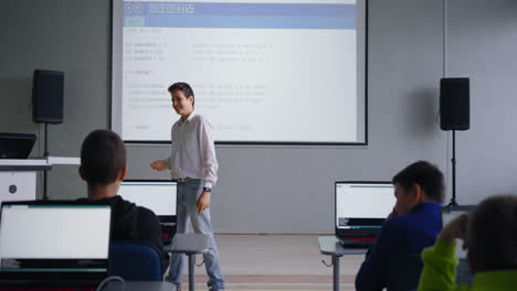 teenager teaching coding class