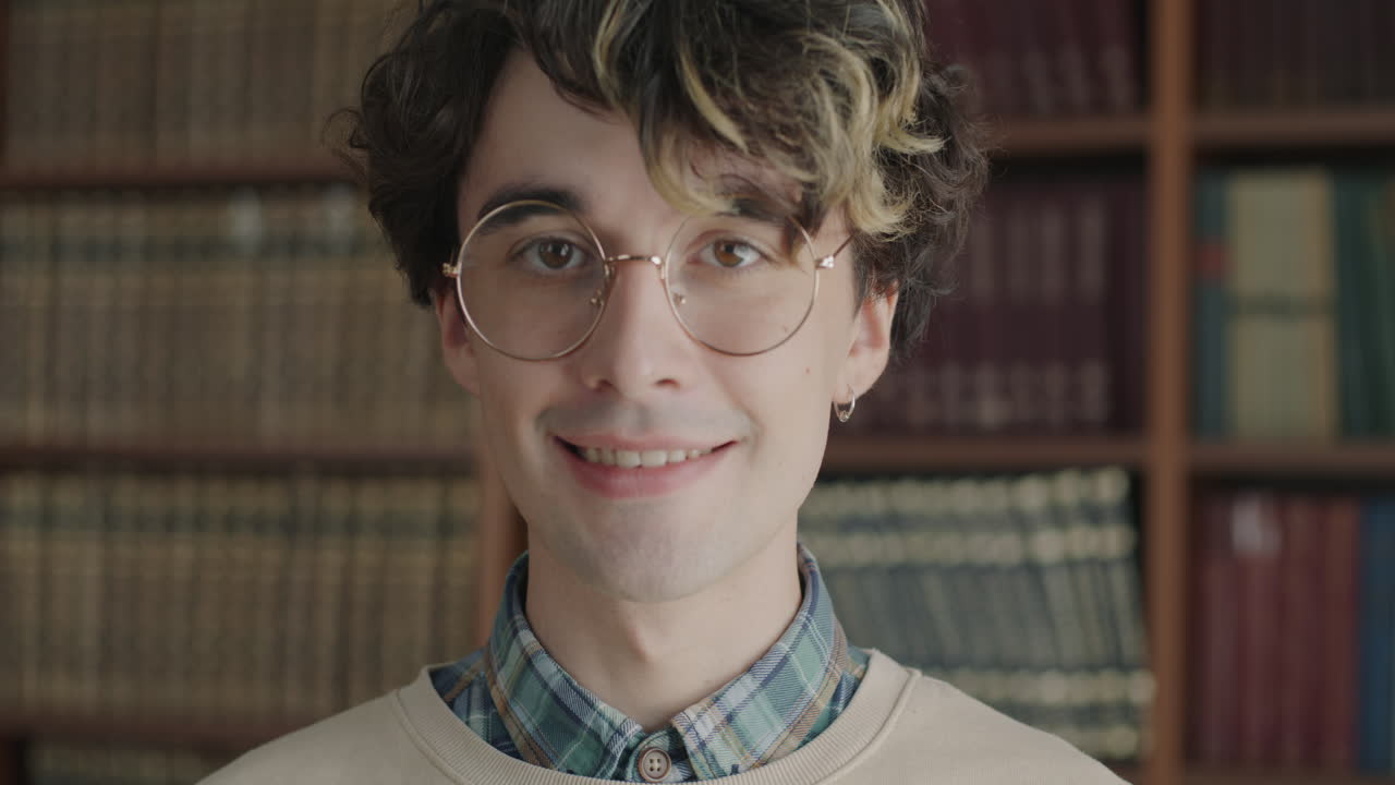 Smiling Young Man in Library