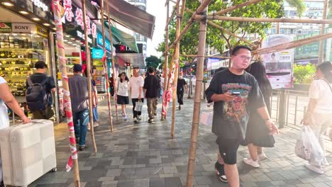 pedestrians navigate a bustling city street