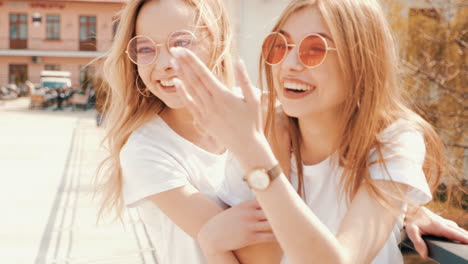 two happy young women enjoying the day outdoors