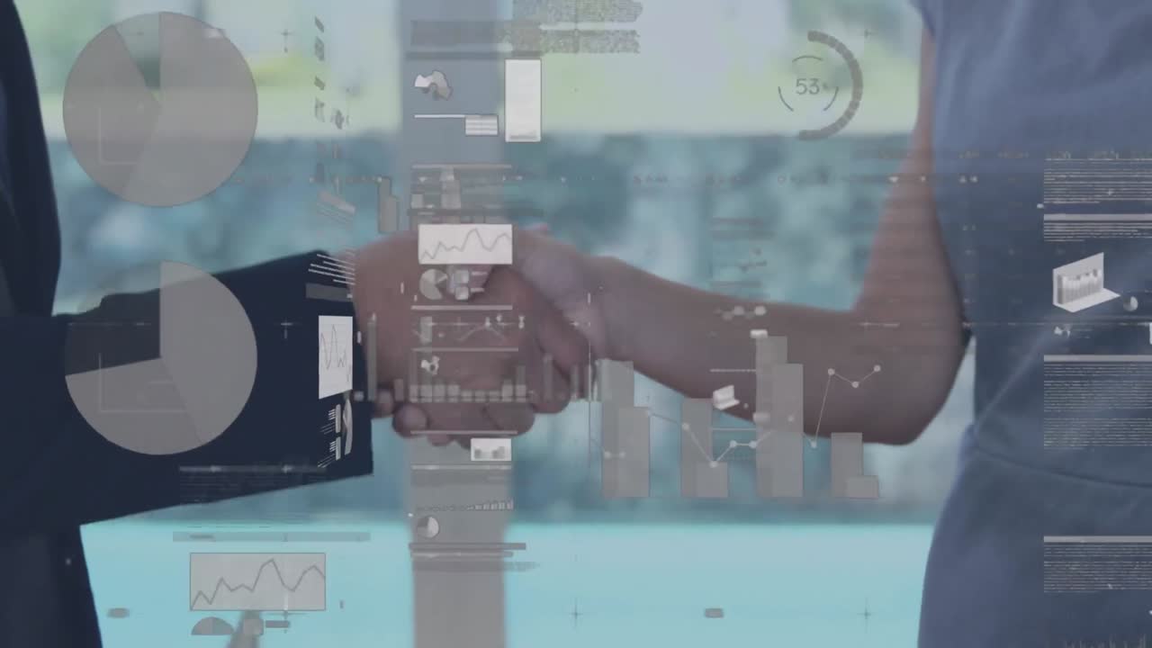 Screens with data processing against mid section of businessman and businesswoman shaking hands