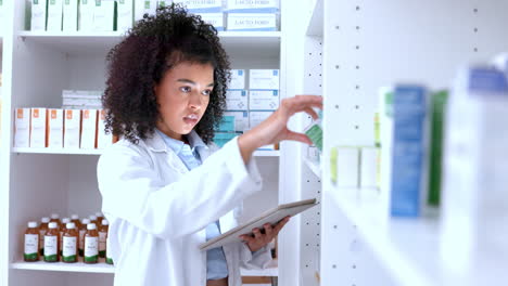 pharmacist checking inventory in pharmacy