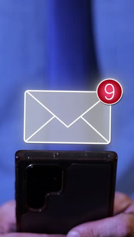 close-up of man typing on smartphone with animated 3d message appearing. vertical video