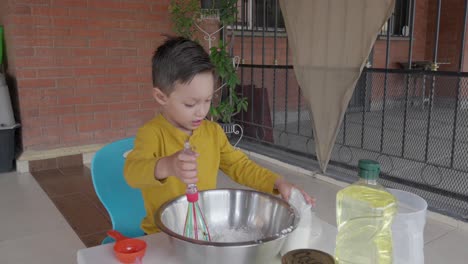 a little boy experimenting and playing with dough