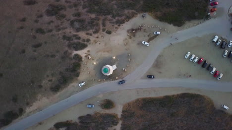 Spinning-aerial-shot-of-the-top-of-the-California-Lighthouse-in-Noord,-Aruba