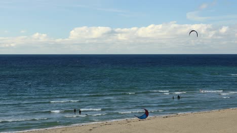 Surfers-Enjoying-Sea-Activities-On-Tropical-Hayle-Beach-In-Cornwall,-England