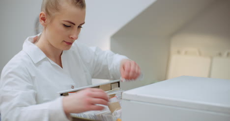 female doctor looks for personal data in the file