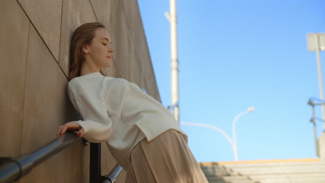 woman in fashionable outfit posing outdoors