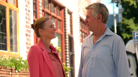 Senior-couple-chatting-in-the-city-on-a-sunny-day