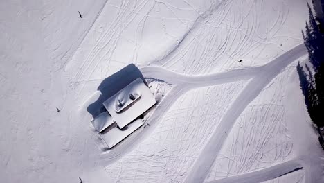 Aerial-of-ski-resort-at-sun-mountains-with-pine-forest