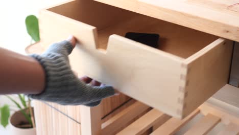 close-up of a light-wood wooden drawer and kitchen cart