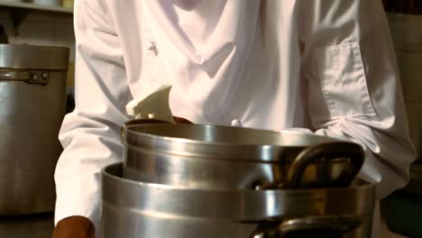 mid-section of chef preparing food