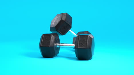 3D-animation-of-black-and-chrome-25kg-dumbbells-on-a-clean-blue-background