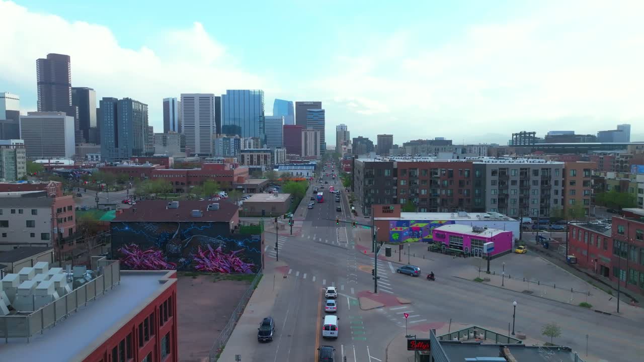 Downtown Denver Rhino art district cityscape businesses buildings aerial drone Colorado tall skyscrapers cars streets spring summer afternoon sunset landscape stormy sunny upwards motion