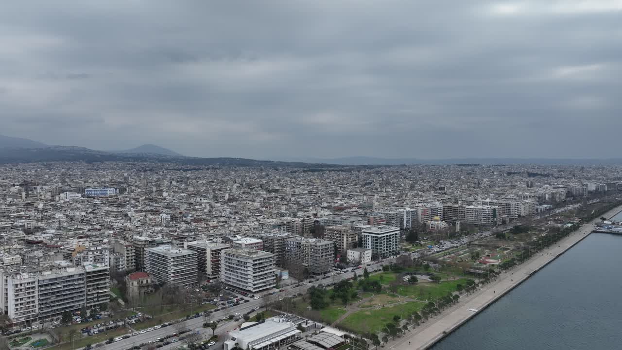 Thessaloniki city, coastline, and thermaic gulf, cloudy sky, aerial view