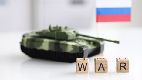 word war is written on background of toy tank and flag of russia closeup 4k movie