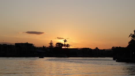 time-lapse of sunset behind a coastal city skyline