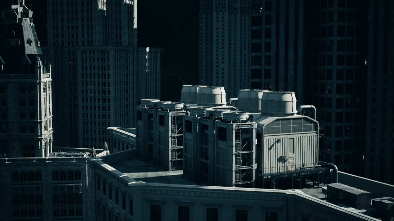 High view of urban buildings with cooling units in a city at dusk