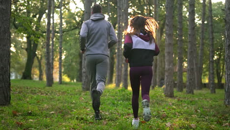 couple running in the forest