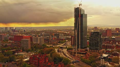 aerial drone pedestal rising shot of manchester city beetham tower sunset, england