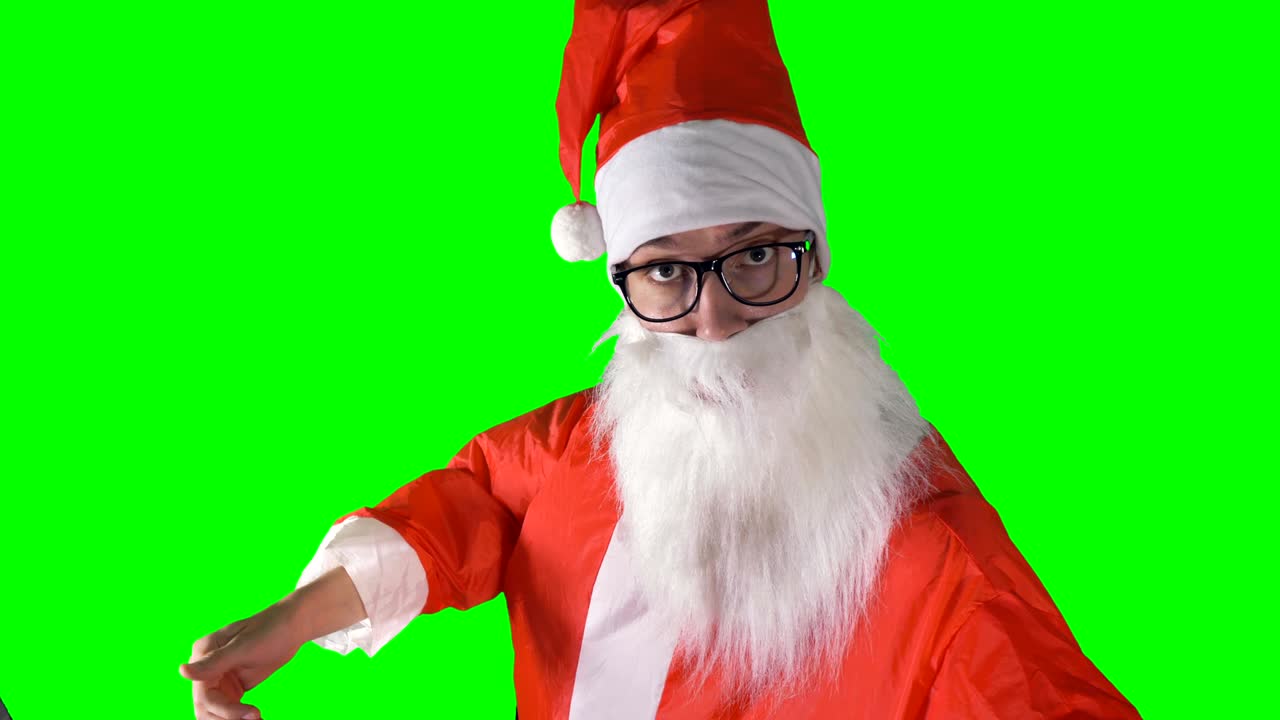 산타클로스가 카메라를 가리키며 손짓하는 클로즈업.