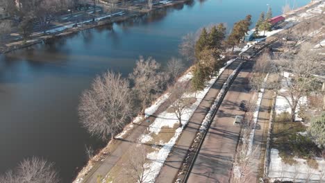 Aerial-footage-showing-street-by-a-lake-shore