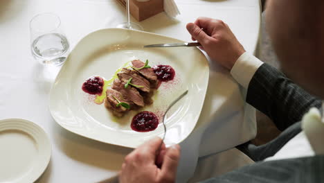 elegant man ready to eat meal in a restaurant