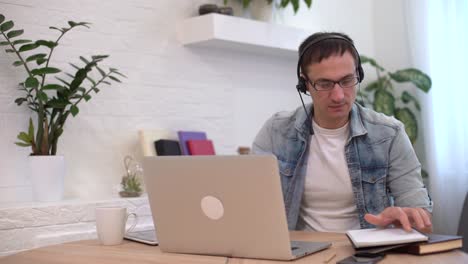 head shot millennial guy sit in living room makes video call looks at camera, conversation by distant videocall, distance hiring job interview process, tutor and trainee study on-line