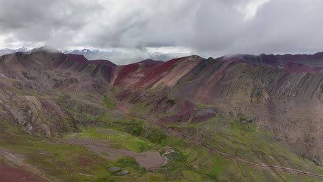 Aerial-fly-drone-view-of-Rainbow-Mountain-,-Vinicunca,-Cusco-Region,-Peru