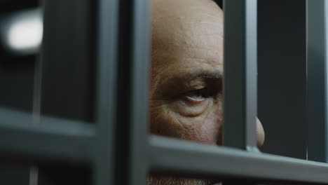 close up of elderly prisoner eating food in prison cell          (stock footage)