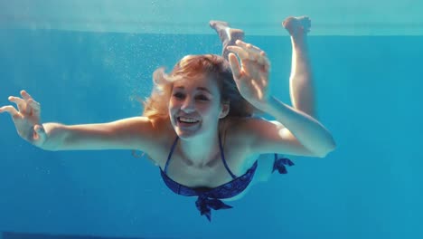 pretty woman swim underwater