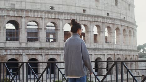 woman visiting the colosseum in rome