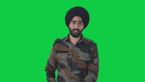 happy sikh indian army man talking to someone green screen