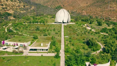 Tilt-up-establishing-aerial-view-of-the-stairs-and-the-Bahai-temple-in-South-America,-on-a-sunny-and-lonely-day,-Santiago,-Chile