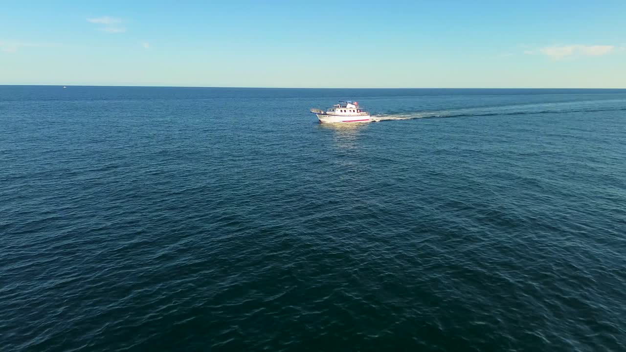 A fishing charter cruising the Atlantic Ocean in sunny south Florida.