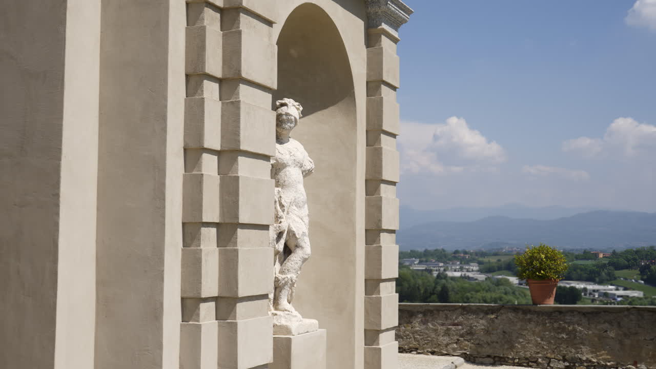 Statue in a niche of an Italian villa