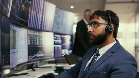 a businessman working at his desk in a financial office