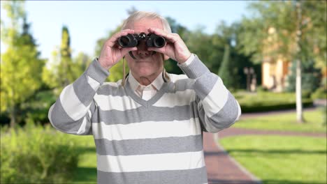 man with binoculars, nature background.