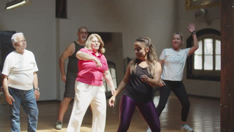 Long-shot-of-senior-people-having-dance-class-with-teacher