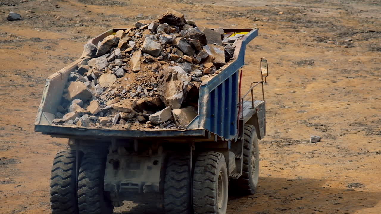 Loaded heavy mining truck. Heavy mining truck working in quarry