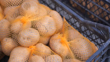 potatoes in orange mesh bags