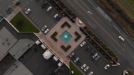 Drone-4K-Footage-top-rotating-shot-of-Hindu-temple-with-beautiful-and-elaborate-sculpture-and-symmetrical-architecture-in-the-middle-of-a-farmland-slowly-Rotating-ascending-bird's-eye-view