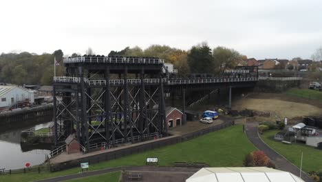 industrial victorian anderton canal boat lift aerial view river weaver low pull back wide orbit right