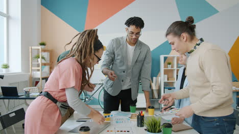 diverse team discussing design project in modern office
